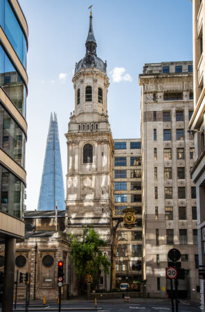 Christopher Wren's church close to London Bridge in the City of London is closed in by office blocks. Until 1831 the approach to the old, inhabited, London Bridge used to pass under the clock just beside the tower. The strange lighting effects are caused by sunlight reflected in windows across the road. The Shard is the other side of the river. (Jan22)