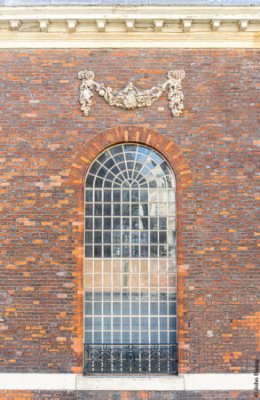 Detail of a window in this red brick church by Christopher Wren. (Jan22)