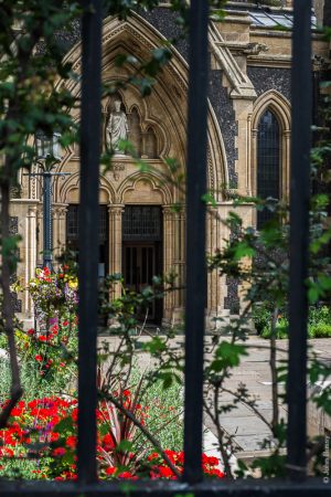 South entrance to Southwark Cathedral seen through railings from Borough Market. (July16)