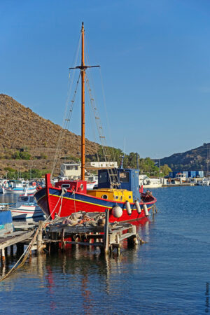 On one side of the large, inland, protected bay within Patmos Island are these rickety jetties across shallow water providing moorings for residents' fishing and pleasure boats. (Sept15)