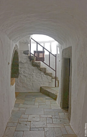 A corridor on the first floor of the monastery of St John the Theologian, and a staircase leading up to the roof. (Sept15)