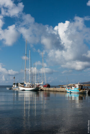 Yachts and fishing boats moored at the jetty in the little village of Maltezana. (Jun18)