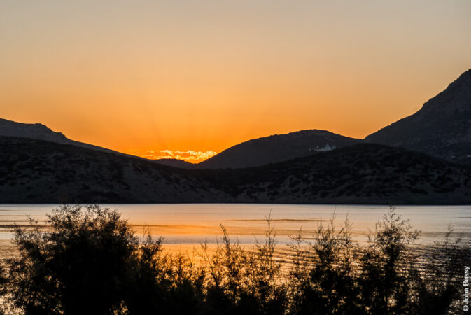 The sun sets over the neighbouring island of Themena. (Sept24)