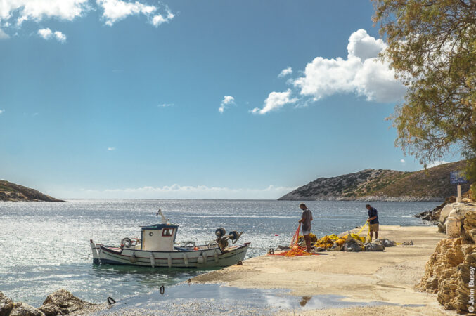 Fishermen sorting out their nets on the quayside at Kampi. (Sept24)