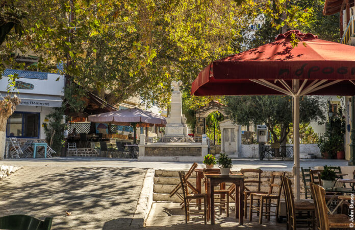 The main Square in Fourni Town is at the top of the "High Street". It has the war memoral, the main church, bars, tavernas and the huge plane tree. (Oct24)