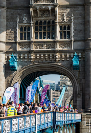 Crowds wait on Tower Bridge for the 2018 London Marathon runners to come through. (Ap18)